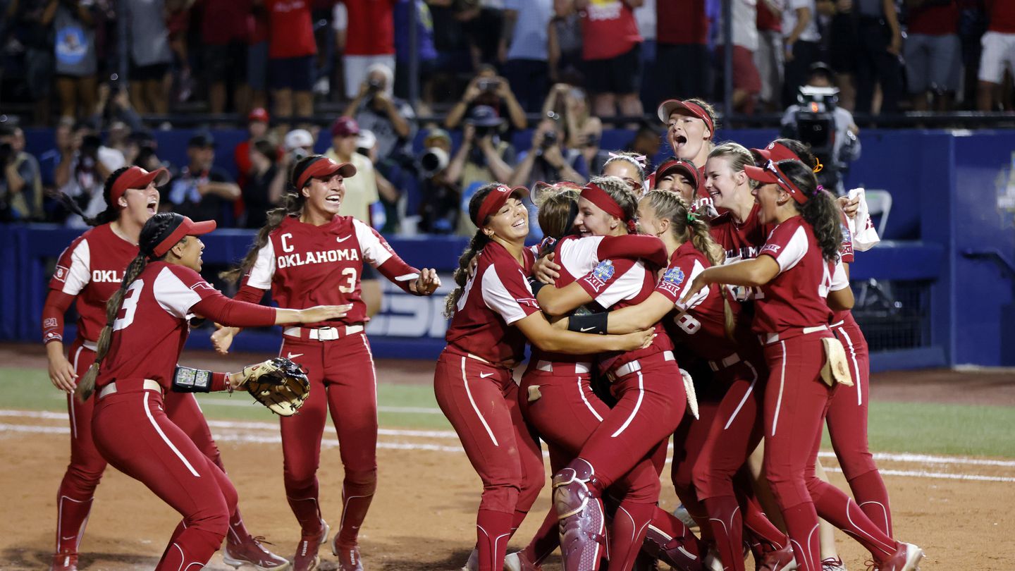 Oklahoma players celebrate after winning their third straight NCAA Women's College World Series championship Thursday.