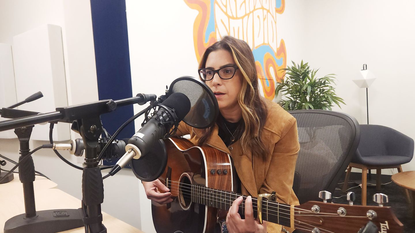 Allison Rose plays a song during the Rhode Island Report podcast.