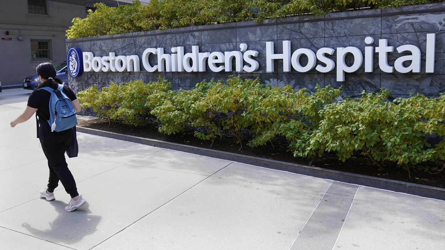 A pedestrian walked past a sign outside the Boston Children's Hospital.