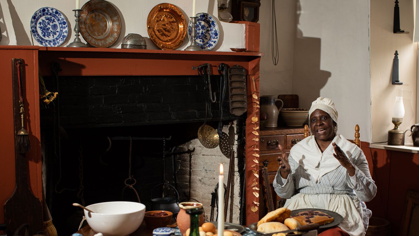 Estelle T. Barada, a historic re-enactor, portrays Duchess Quamino, at 18th-century enslaved woman known as the "pastry queen of Rhode Island," at Hearthside House Museum in Lincoln, R.I.