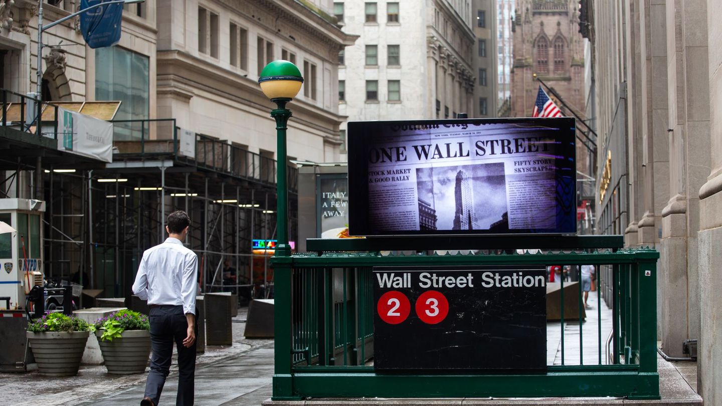 A pedestrian passes a Wall Street subway station near the New York Stock Exchange in New York on June 27, 2022.