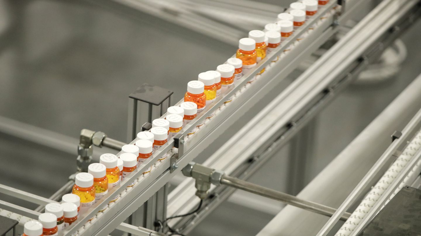 Bottles of medicine on a belt at a mail-in pharmacy warehouse in Florence, N.J., in July 2018.
