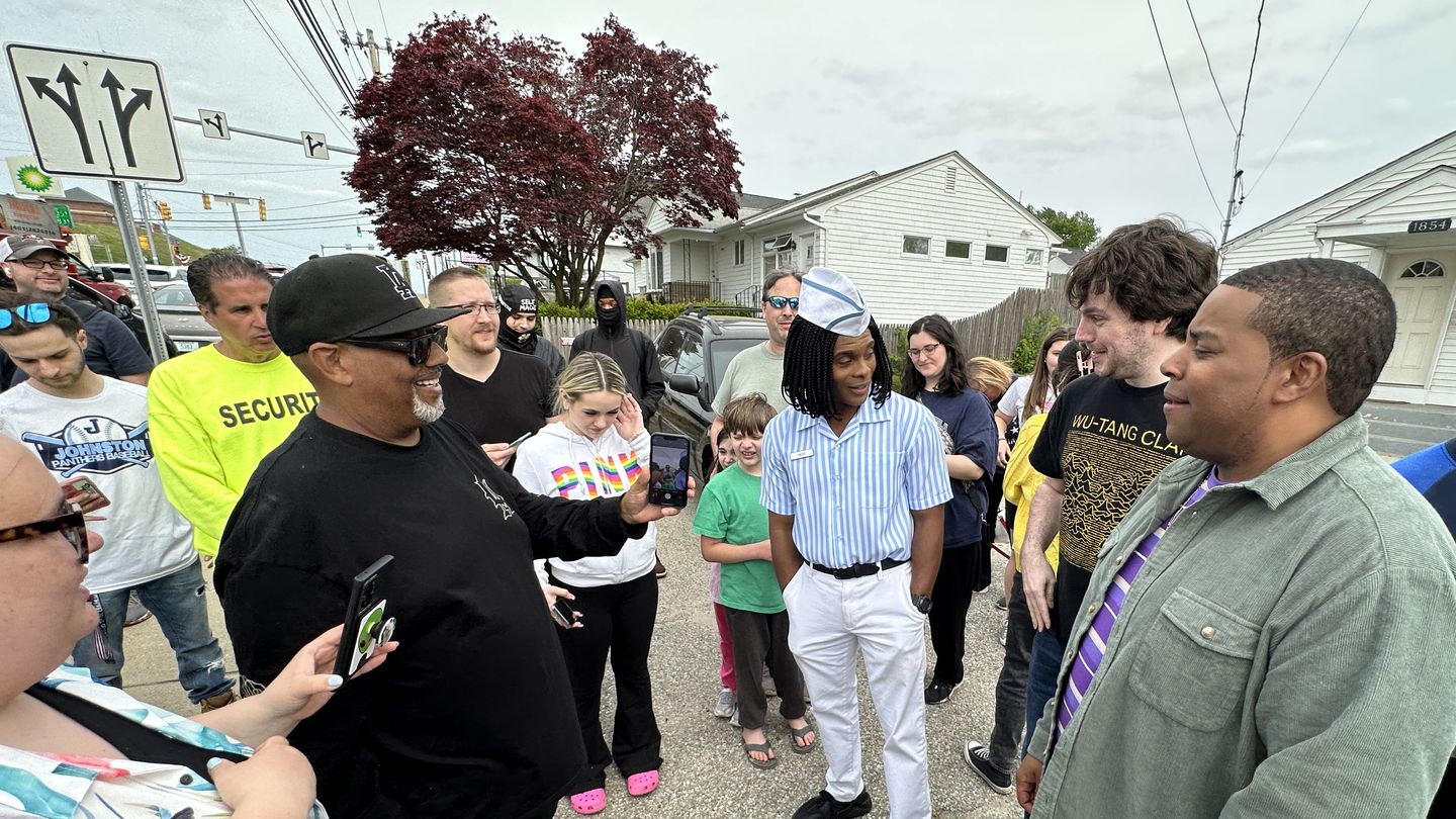 Saturday Night Live actor Kenan Thompson, right, and actor Kel Mitchell, center, in striped shirt, who are filming "Good Burger 2" in Rhode Island, have been greeting and taking photo with fans.