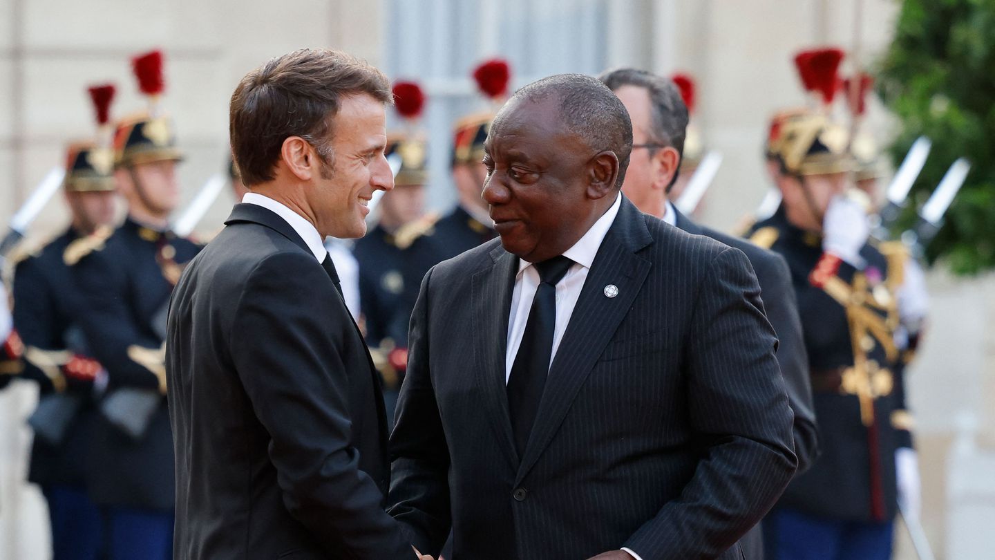 French President Emmanuel Macron (left) greeted South Africa's President Cyril Ramaphosa upon arrival for an official dinner at the Elysee Palace, on the sidelines of the New Global Financial Pact Summit, in Paris, on Thursday.